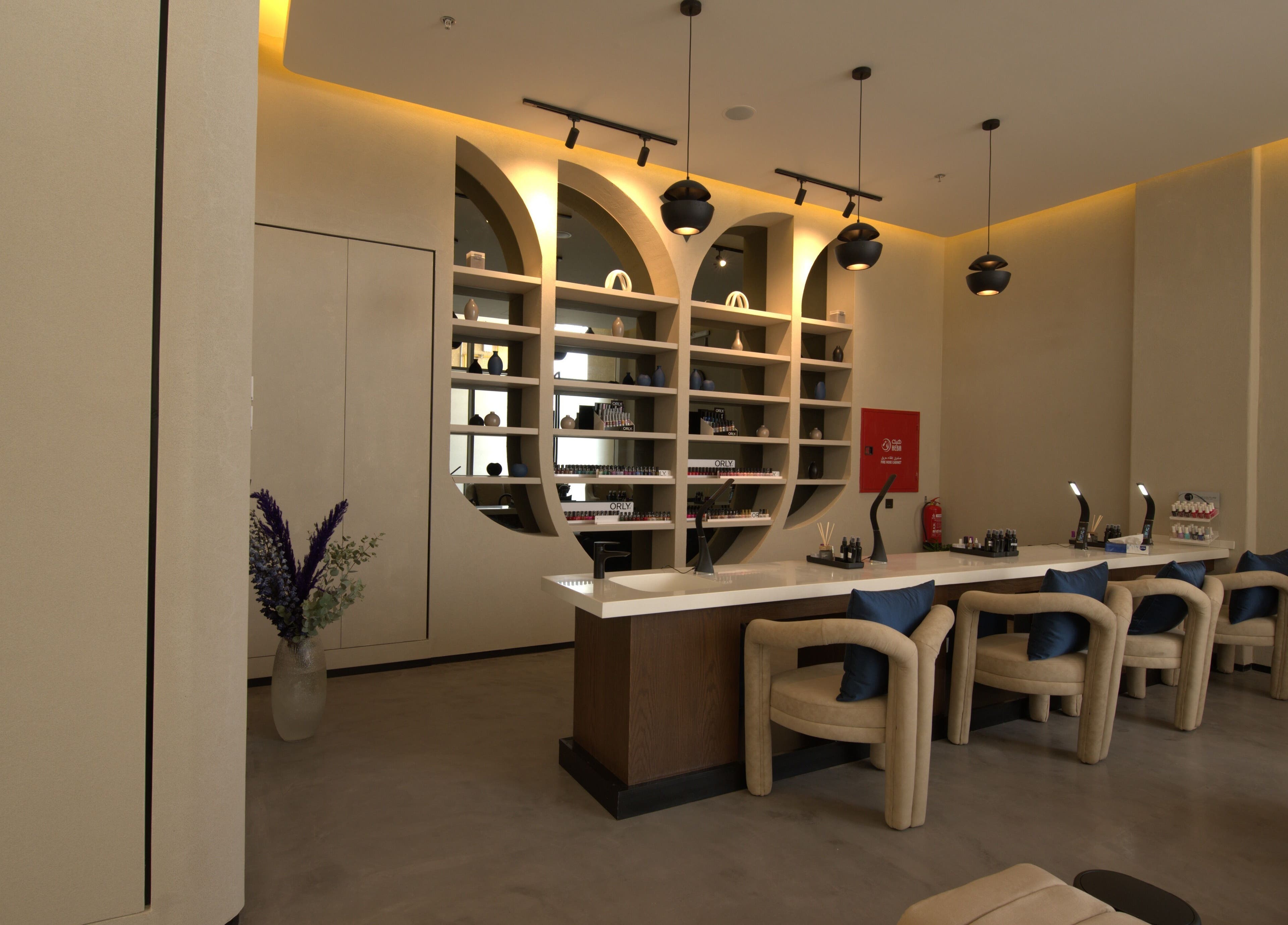 Elegant salon lounge at Lolia Salon and Spa, Riyadh, Riyadh Province, SA with stylish decor and nail care stations.