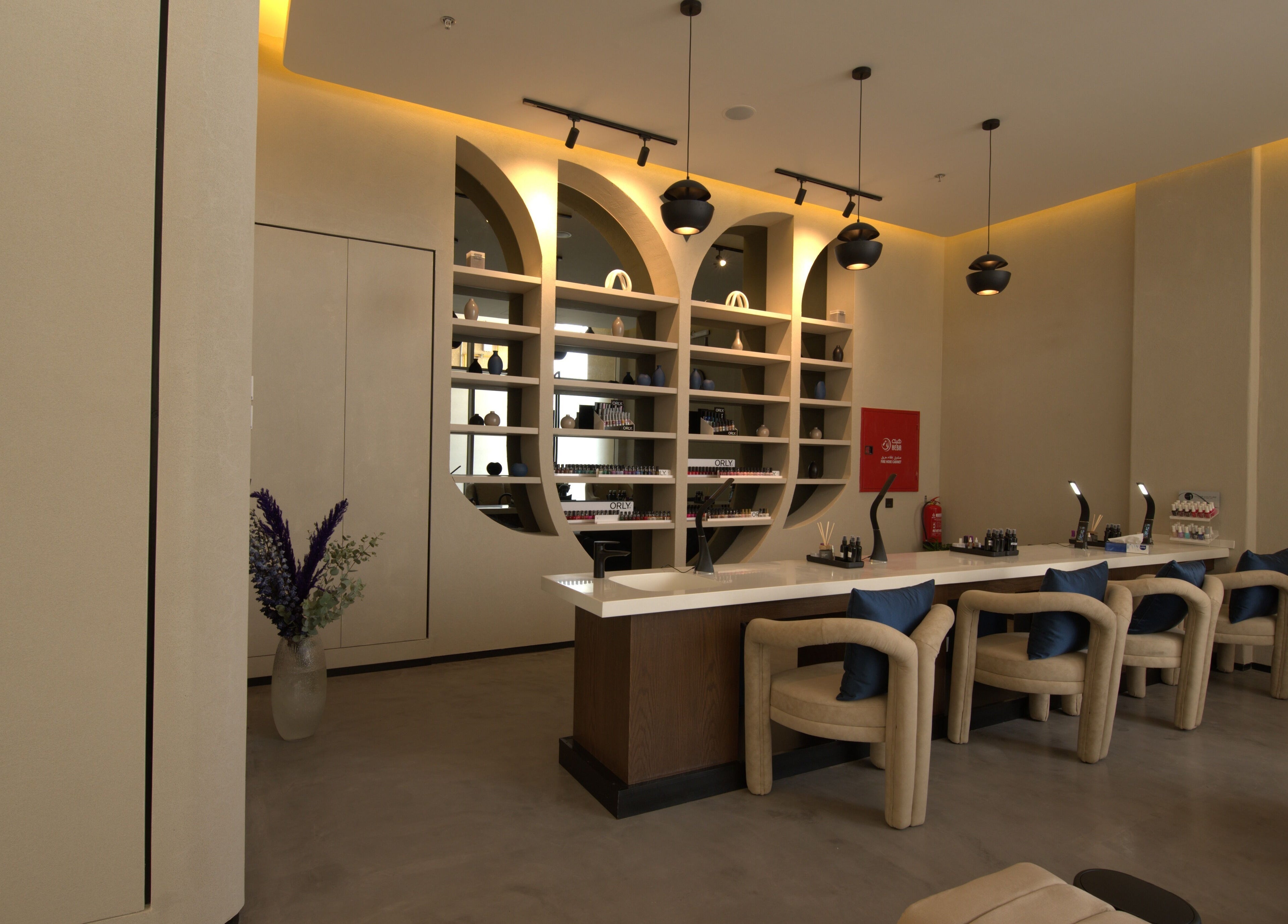 Elegant salon lounge at Lolia Salon and Spa, Riyadh, Riyadh Province, SA with stylish decor and nail care stations.