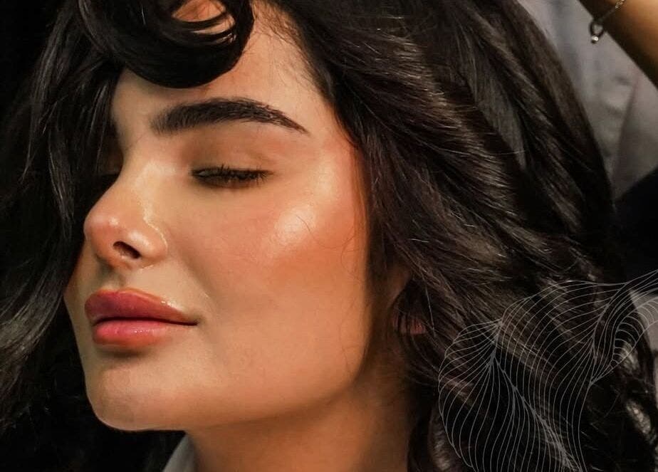 Relaxed woman with styled hair at Lolia Salon and Spa, Riyadh, Riyadh Province, SA. Beauty and wellness.