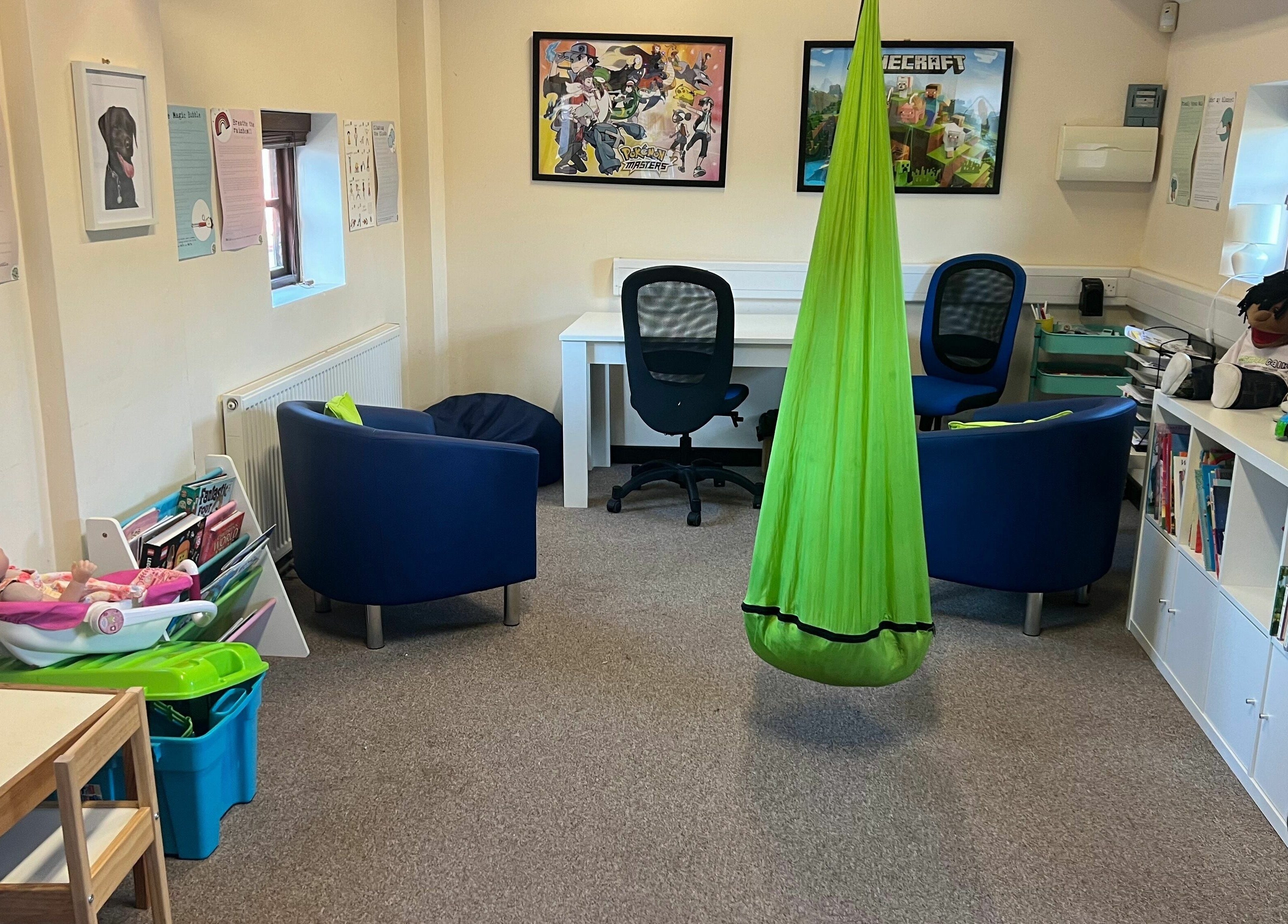 Cozy interior of Small Talk Speech and Language Therapy in Derby, England, GB with comfortable seating and play area.