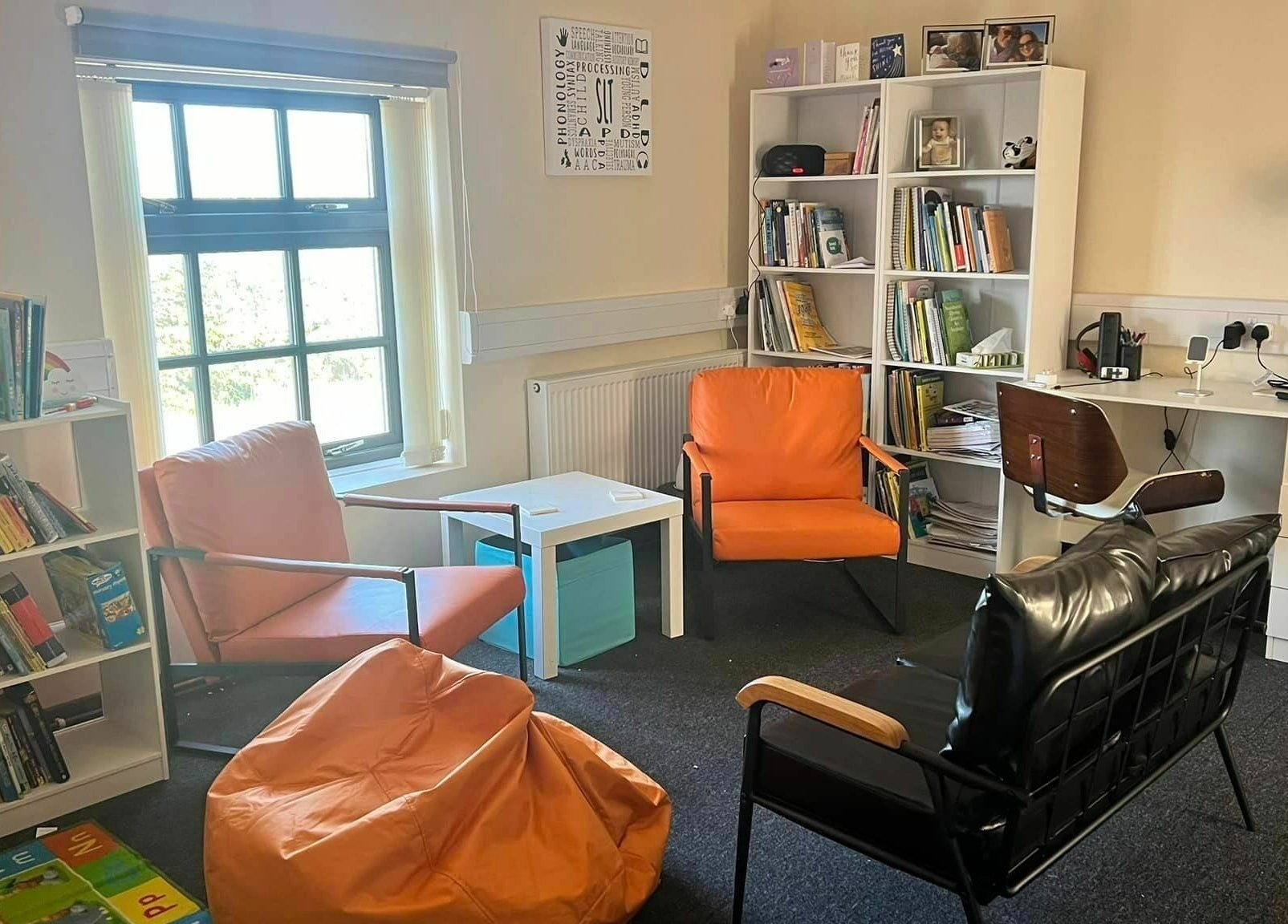 Comfortable therapy room at Small Talk Speech and Language Therapy, Derby, England, GB with books and seating.