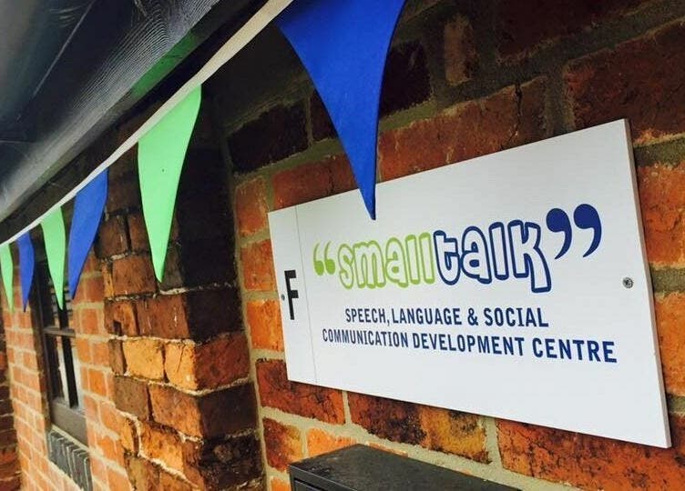 Exterior view of Small Talk Speech and Language Therapy in Derby, England, GB, showcasing a sign and colorful bunting.