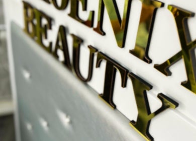 Elegant gold Phoenix Beauty By Marianna Ori sign at Wirral, England, GB amidst chic interiors.