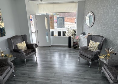 Cozy lounge with armchairs at Phoenix Beauty By Marianna Ori, Wirral, England, GB, offering a serene ambiance.