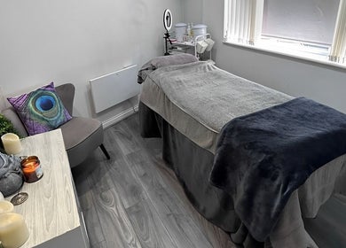 Relaxing treatment room at Phoenix Beauty By Marianna Ori, Wirral, England, GB, featuring a comfy massage bed.