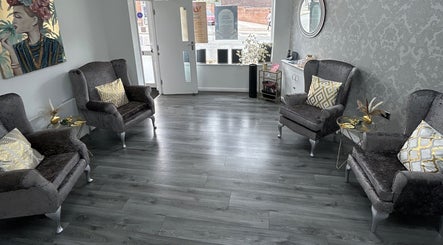Elegant seating area at Phoenix Beauty By Marianna Ori, Wirral, England, GB, featuring plush chairs and decor.