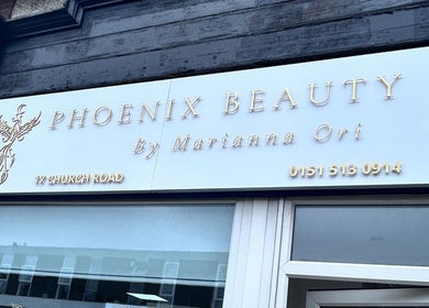 Phoenix Beauty By Marianna Ori storefront sign at Wirral, England, GB, showcasing elegant lettering.