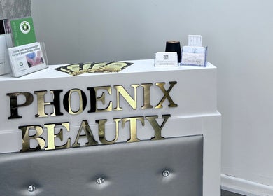 Reception desk at Phoenix Beauty By Marianna Ori, Wirral, England, GB with brochures and business cards.