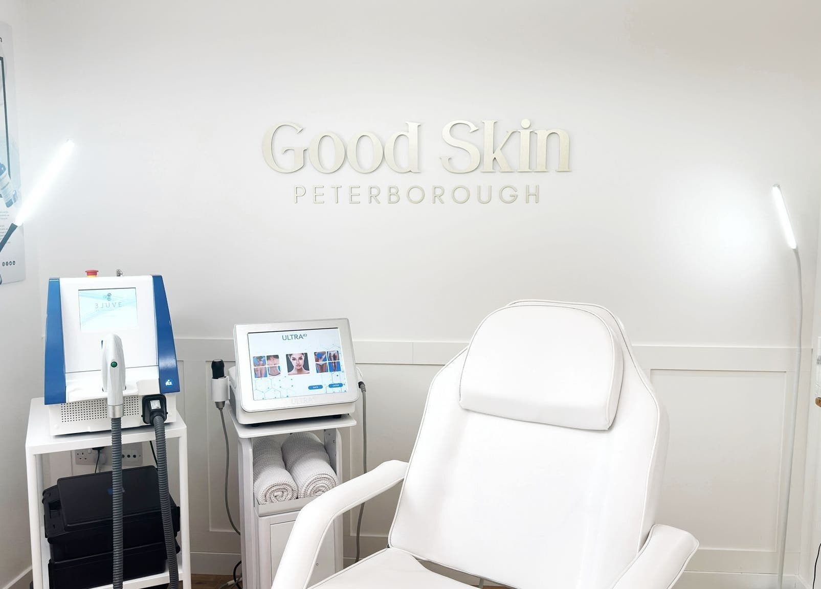 Modern treatment room at The Good Skin Clinic, Peterborough, England, GB, featuring sleek equipment and cozy chair.