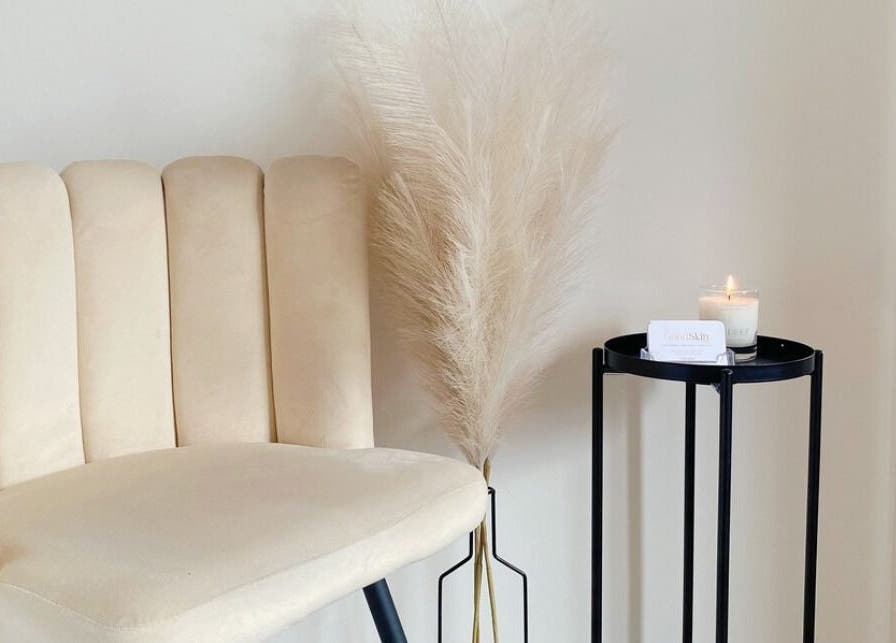 Elegant seating with a beige chair and decor at The Good Skin Clinic in Peterborough, England, GB.