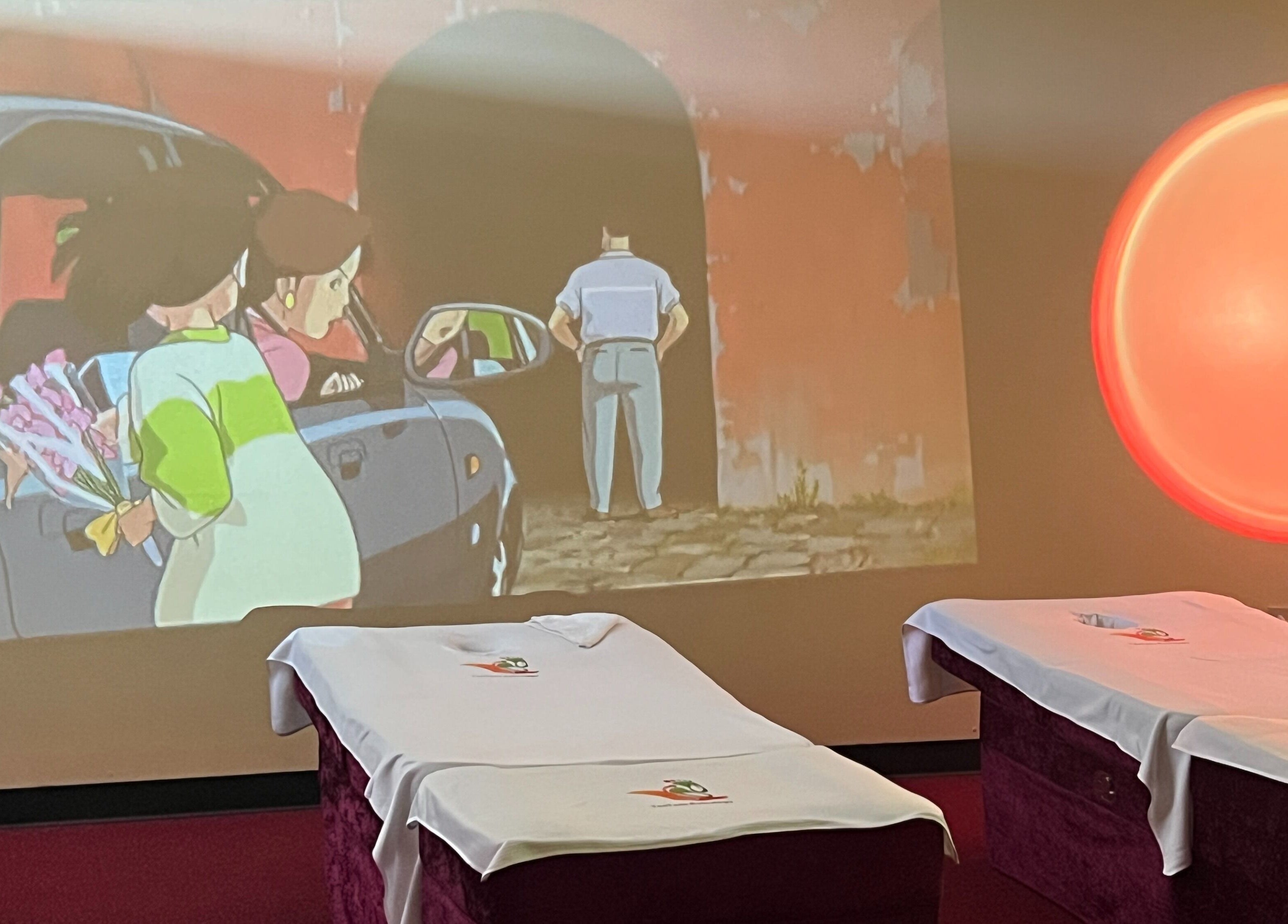 Serene massage room at Ten Toes Reflexology, Lawrence, Kansas, US with cozy treatment beds and ambient lighting.