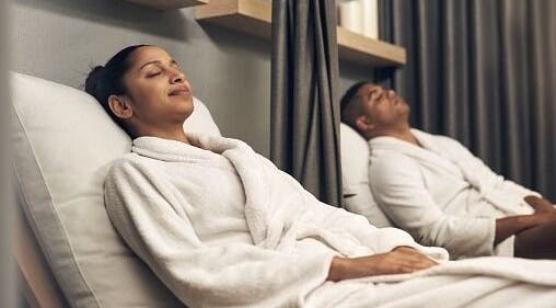 Guests relax in robes at KC Reflexology, Lee's Summit, Missouri, US for ultimate wellness experience.