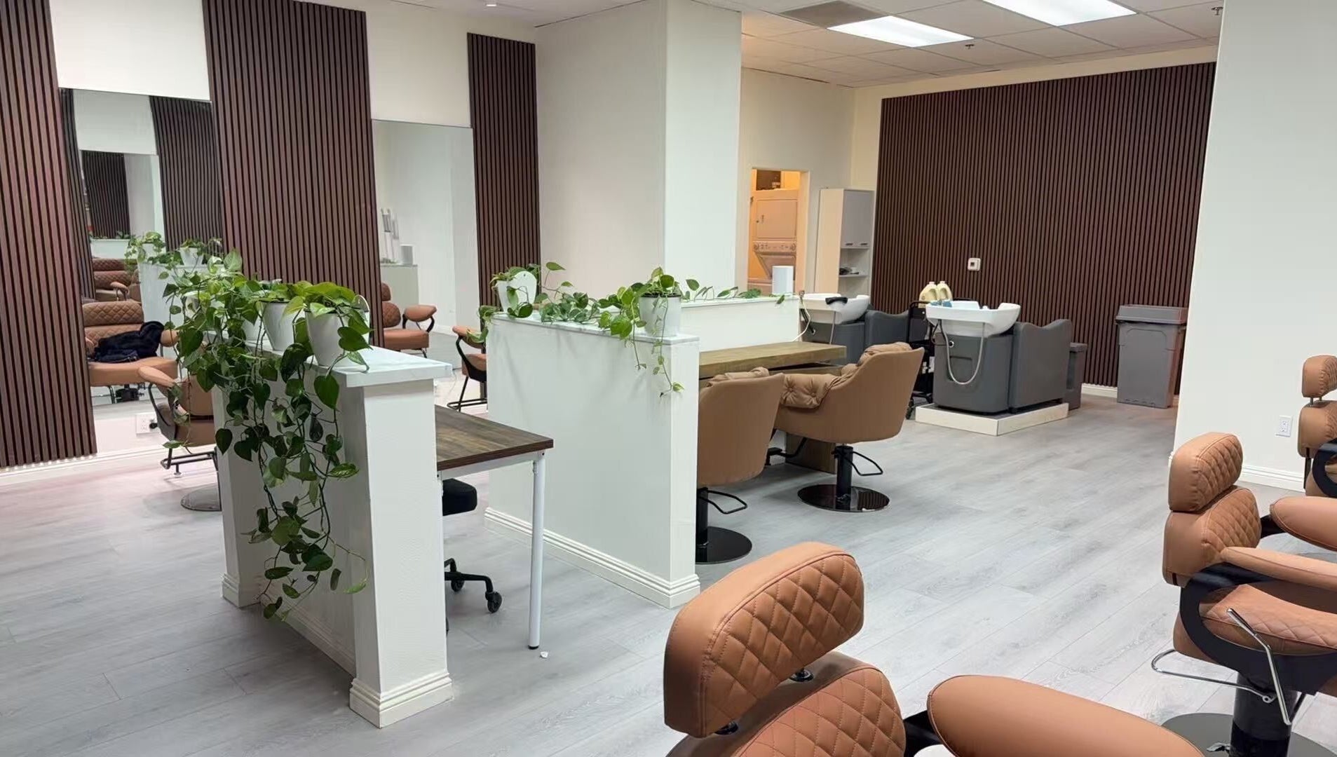 Chic interior of Hair Moment salon in Rowland Heights, California, US with stylish chairs and sleek decor.