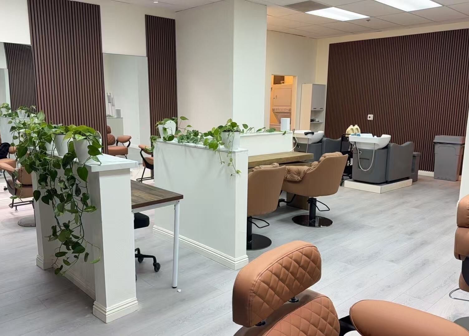 Chic interior of Hair Moment salon in Rowland Heights, California, US with stylish chairs and sleek decor.