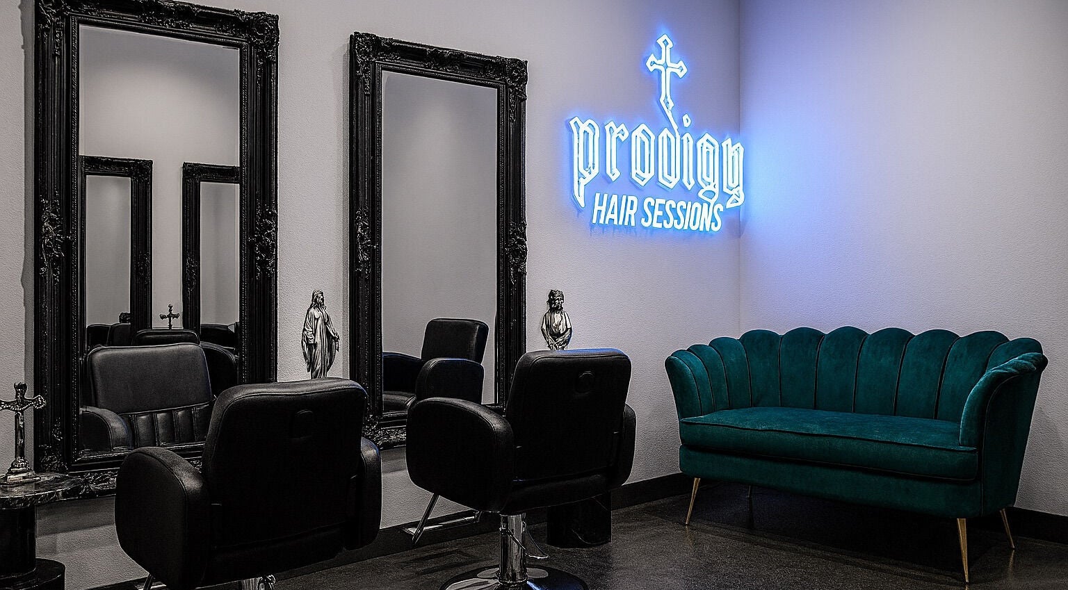 Luxurious interior of PRODIGY HAIR SESSIONS, Melbourne, Victoria, AU, featuring chic mirrors and plush seating.