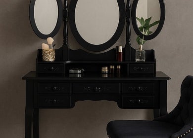Elegant vanity setup at PRODIGY HAIR SESSIONS, Melbourne, Victoria, AU. Features black mirror and plush chair.