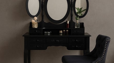 Elegant vanity setup at PRODIGY HAIR SESSIONS, Melbourne, Victoria, AU. Features black mirror and plush chair.