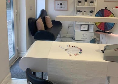 Elegant nail station at Dream Therapy in Sunderland, England, GB, featuring modern decor and nail color samples.