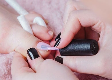 Pedicure service at Dream Therapy in Sunderland, England, GB with black nail polish application.