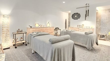 Nirama Healing Therapies Centre massage room with twin beds in Adeje, Canarias, ES for relaxation.