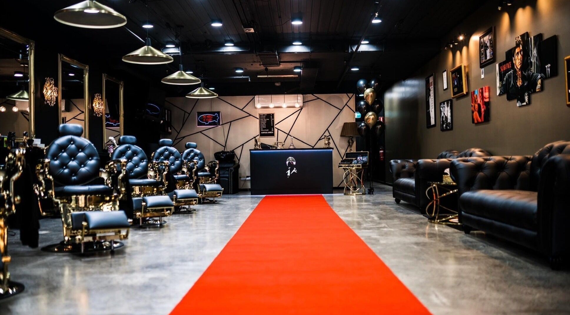 Luxurious interior of Scarfades Barbers in Melbourne, Victoria, AU, featuring elegant chairs and a red carpet.