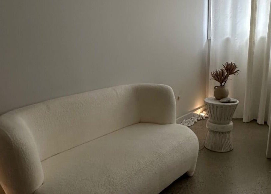 Elegant waiting area at Glow Szn, Condell Park, New South Wales, AU, featuring plush seating and soft lighting.