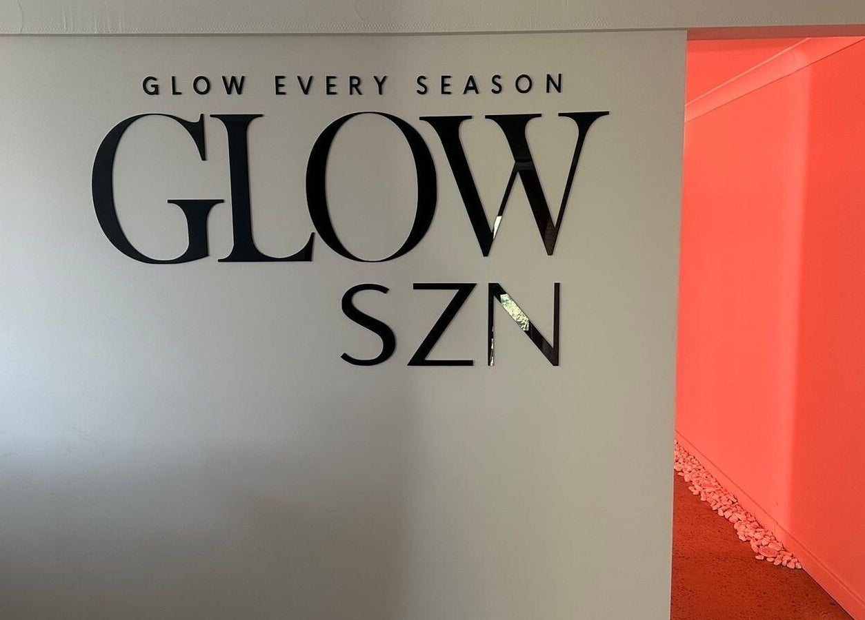 Entrance to Glow Szn at Condell Park, New South Wales with bold signage and warm lighting.