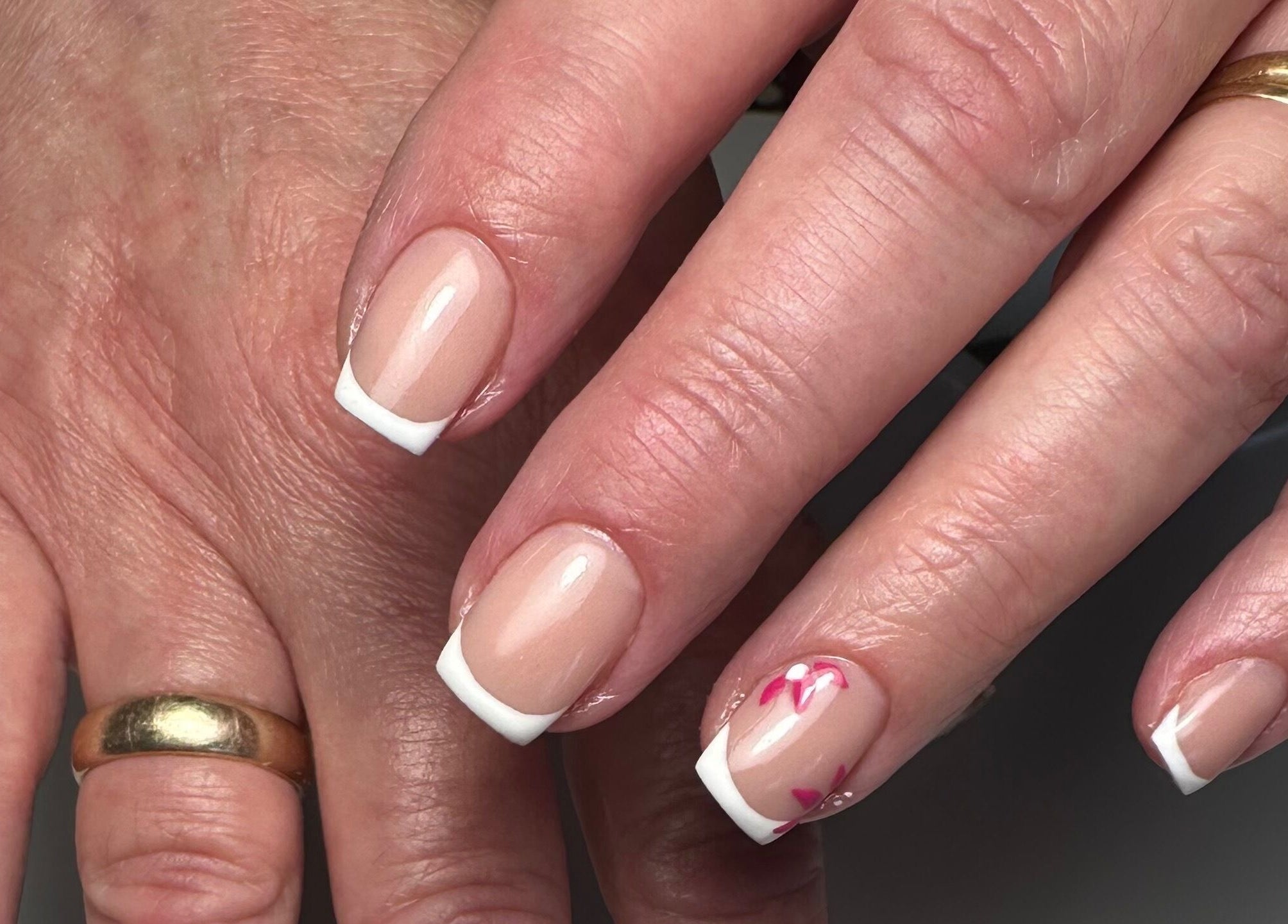 French manicure with floral design at A Touch of Colour, Eastleigh, England, GB.