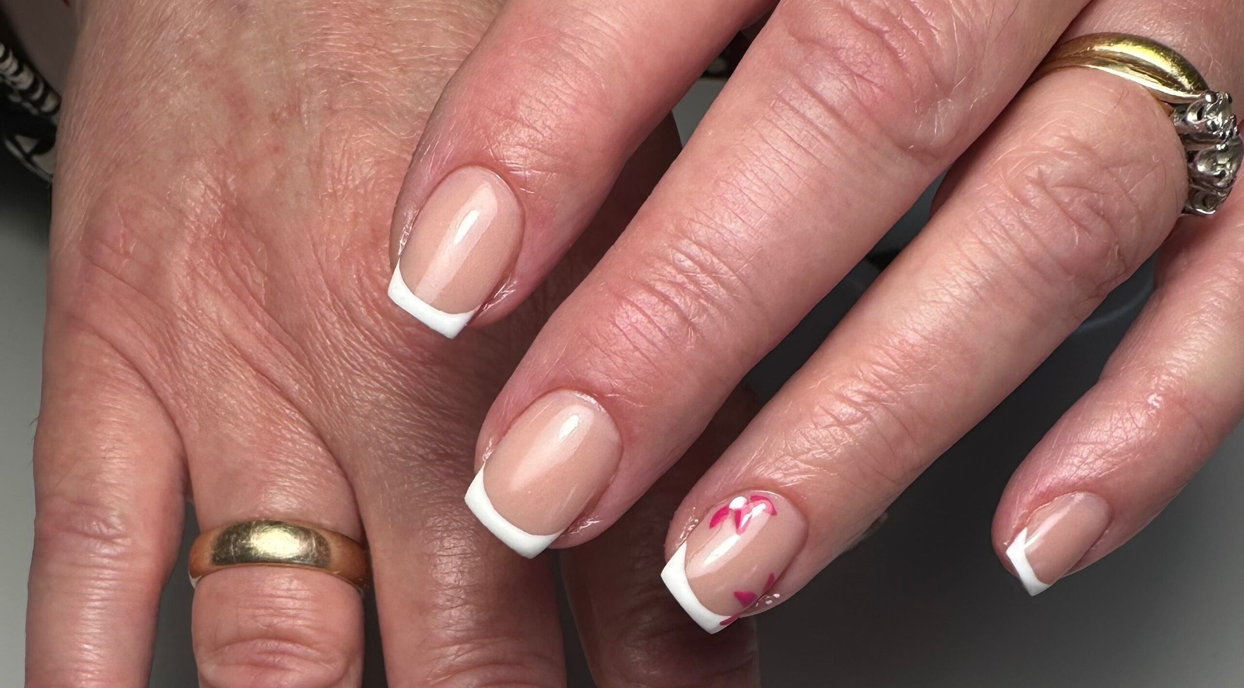 French manicure with floral design at A Touch of Colour, Eastleigh, England, GB.