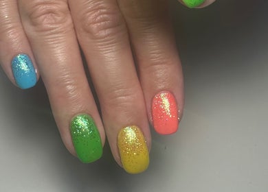 Colorful glitter nails at A Touch of Colour, Eastleigh, England, GB.