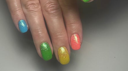 Colorful glitter nails at A Touch of Colour, Eastleigh, England, GB.