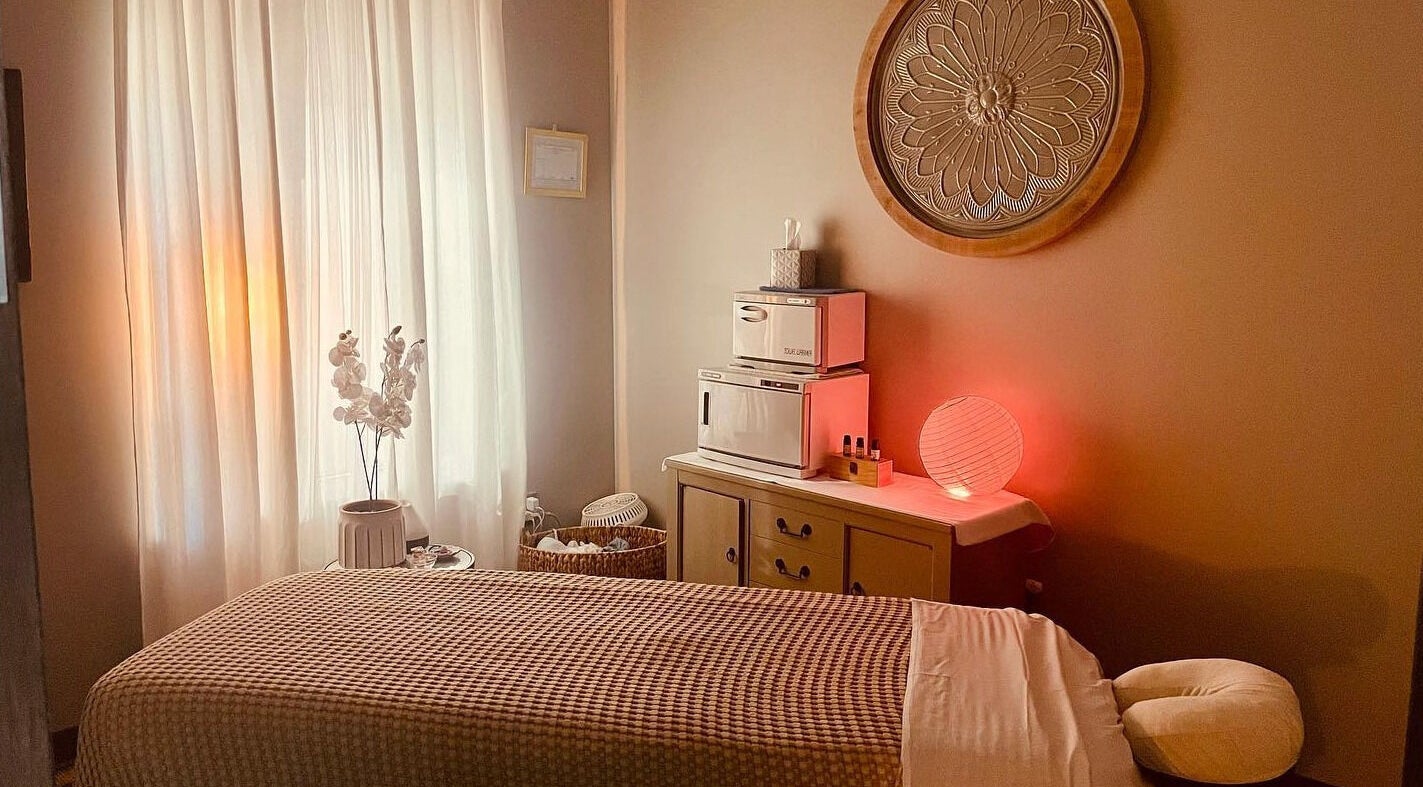 Cozy massage room at Massage Blu Spa, Allen Park, Michigan, US with calming decor and warm lighting.