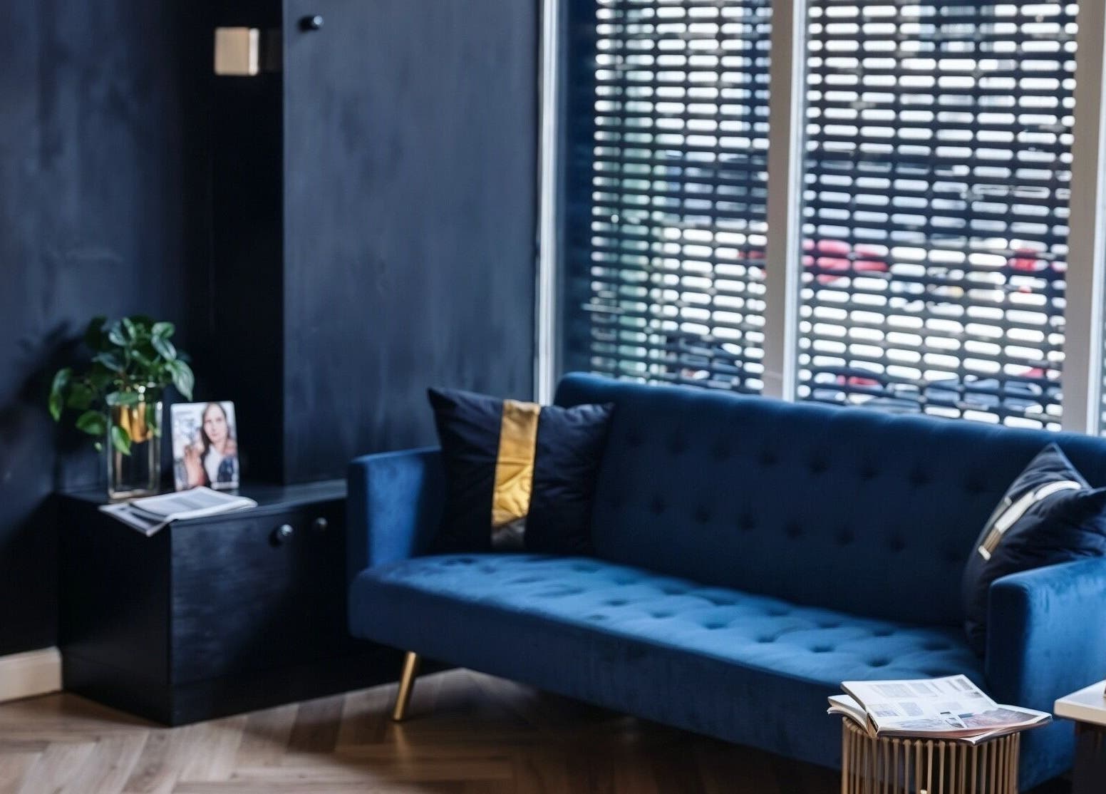 Elegant lounge area with blue sofa at E.L.M Academy, Bacup, England, GB.