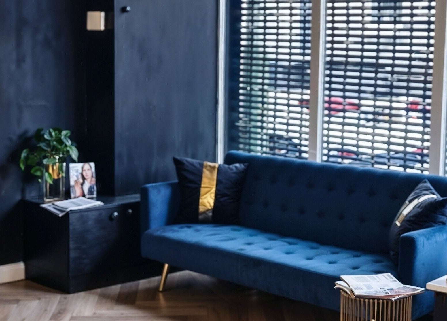 Elegant lounge area with blue sofa at E.L.M Academy, Bacup, England, GB.