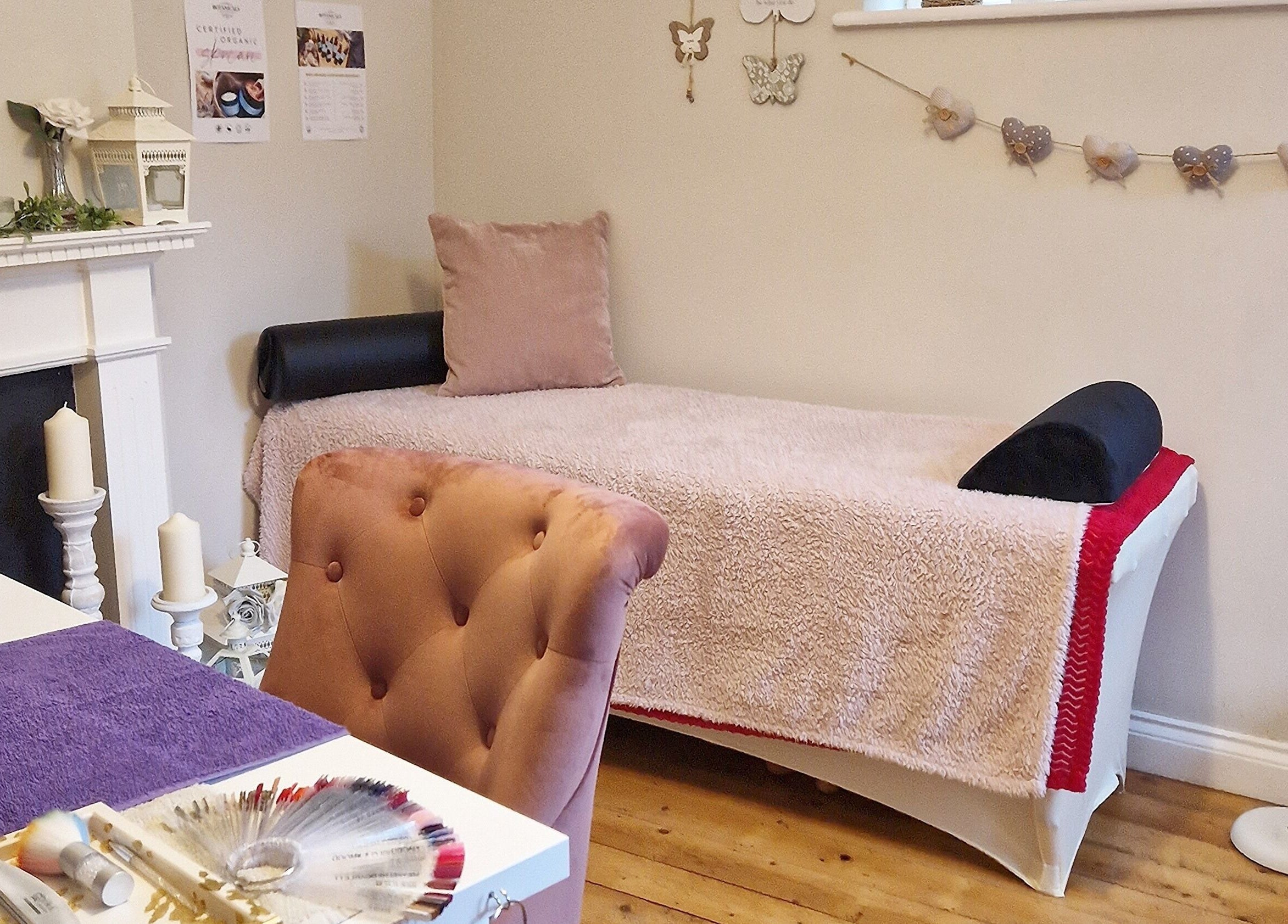 Cozy treatment room at Radiant Rose Beauty Room, Salisbury, England, GB with elegant decor and plush seating.