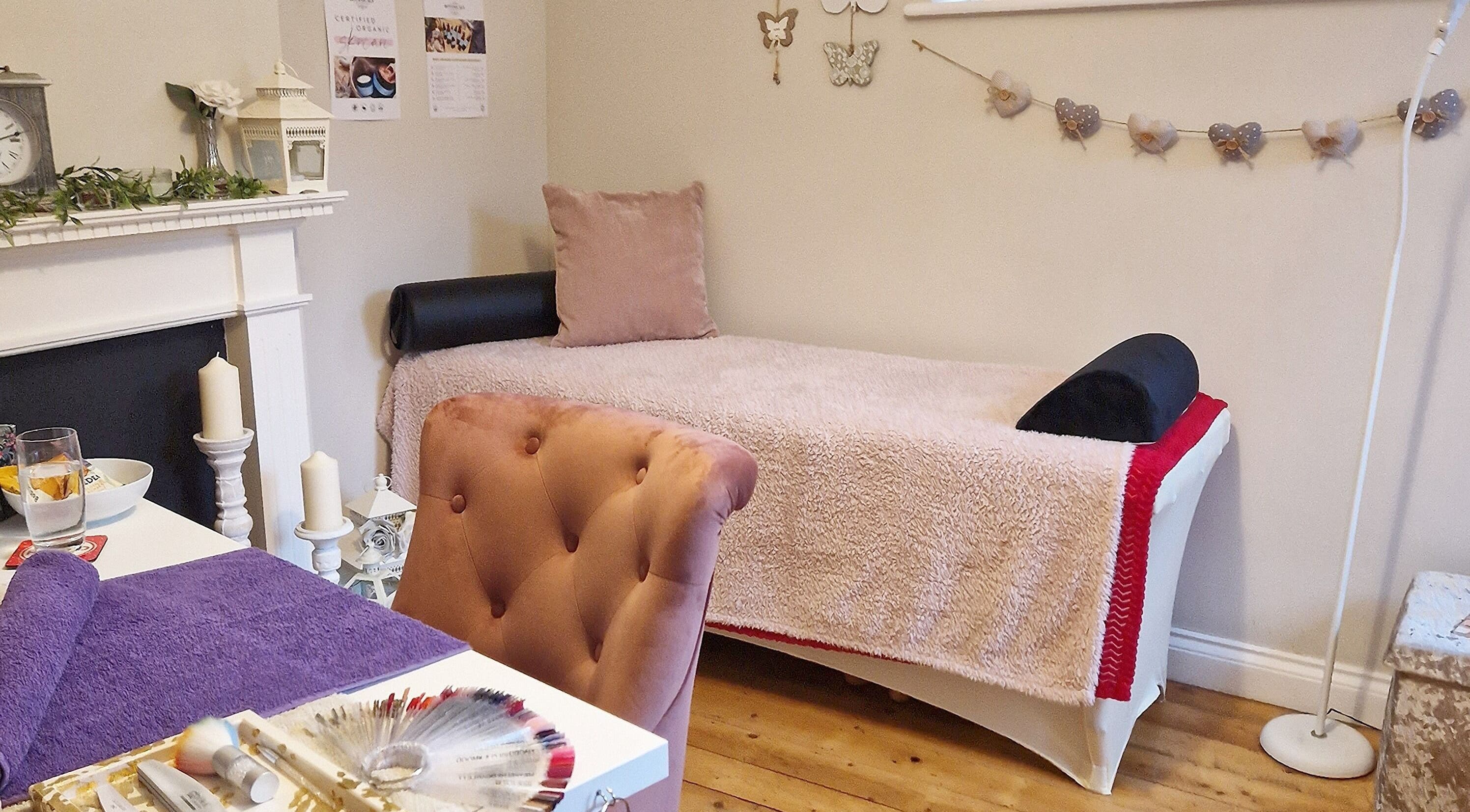 Cozy treatment room at Radiant Rose Beauty Room, Salisbury, England, GB with elegant decor and plush seating.