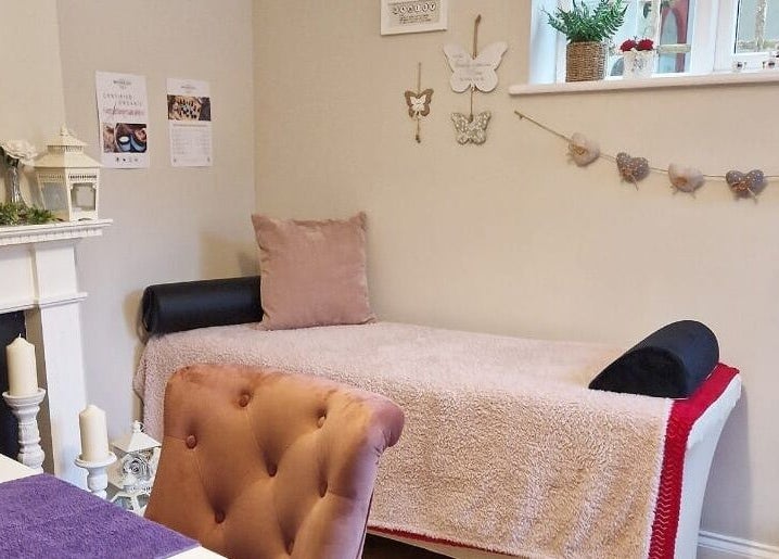 Relaxing treatment room at Radiant Rose Beauty Room in Salisbury, England, GB, with soft pink decor.