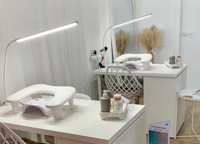 Modern nail station at Palm Beauty Noosa in Noosaville, Queensland, AU featuring elegant white decor.