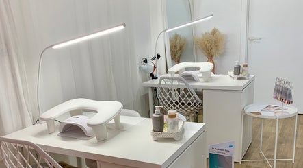 Modern nail station at Palm Beauty Noosa in Noosaville, Queensland, AU featuring elegant white decor.