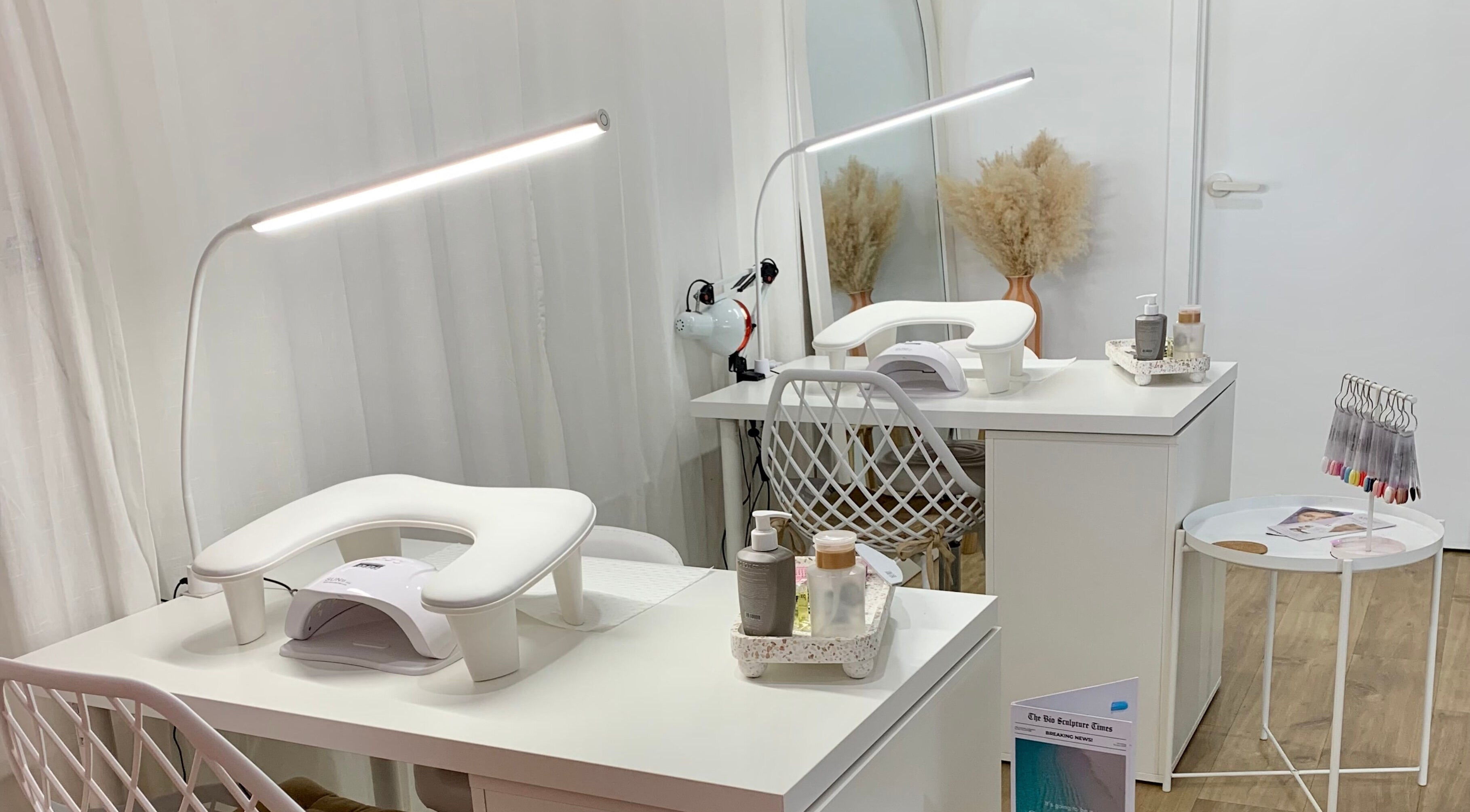 Modern nail station at Palm Beauty Noosa in Noosaville, Queensland, AU featuring elegant white decor.
