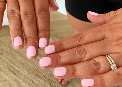 Pink manicured nails at Palm Beauty Noosa in Noosaville, Queensland, AU. Perfectly polished for a stylish look.