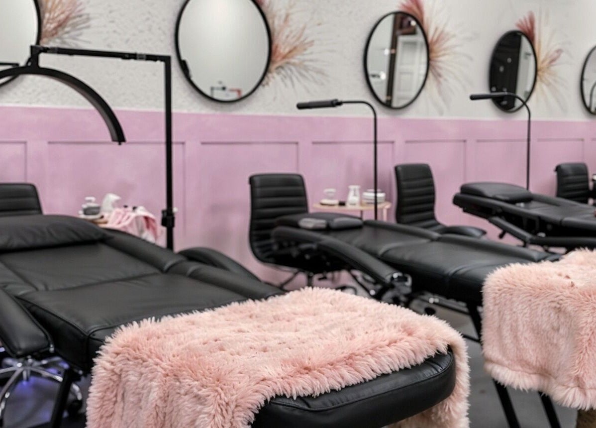 Luxurious reclining chairs in Babe Cave Studio, River Oaks, Texas, US adorned with pink throws.
