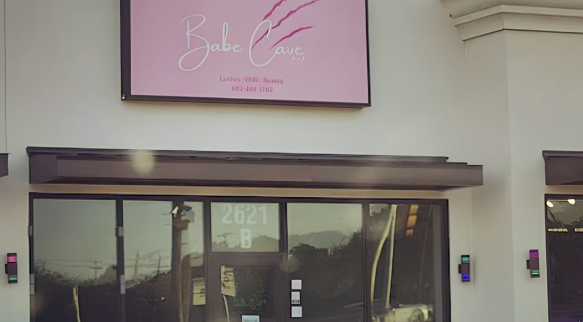 Exterior view of Babe Cave Studio in River Oaks, Texas, featuring stylish signage.