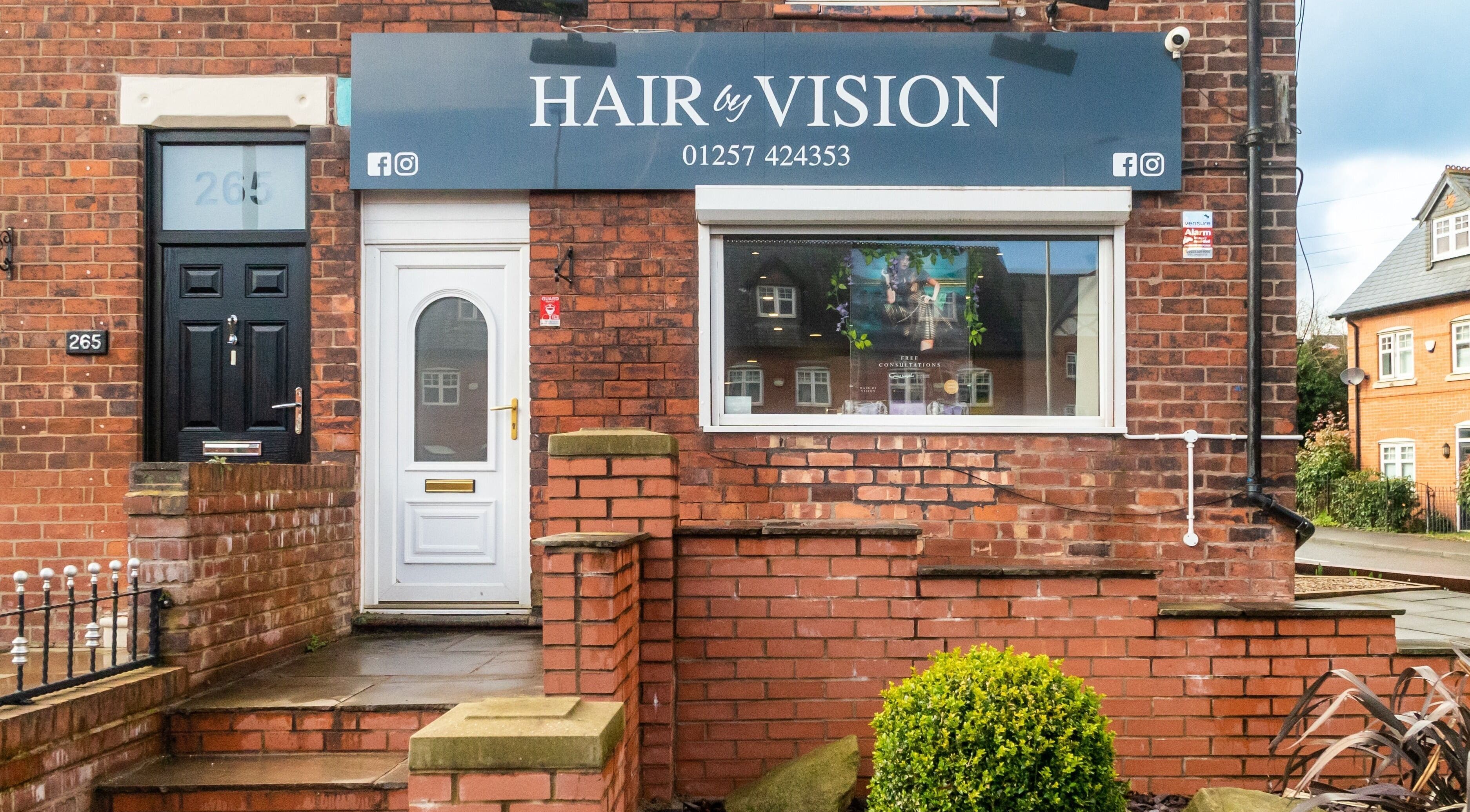 Front view of Hair by Vision Standish, located at Standish, England, GB showing entrance and signage.