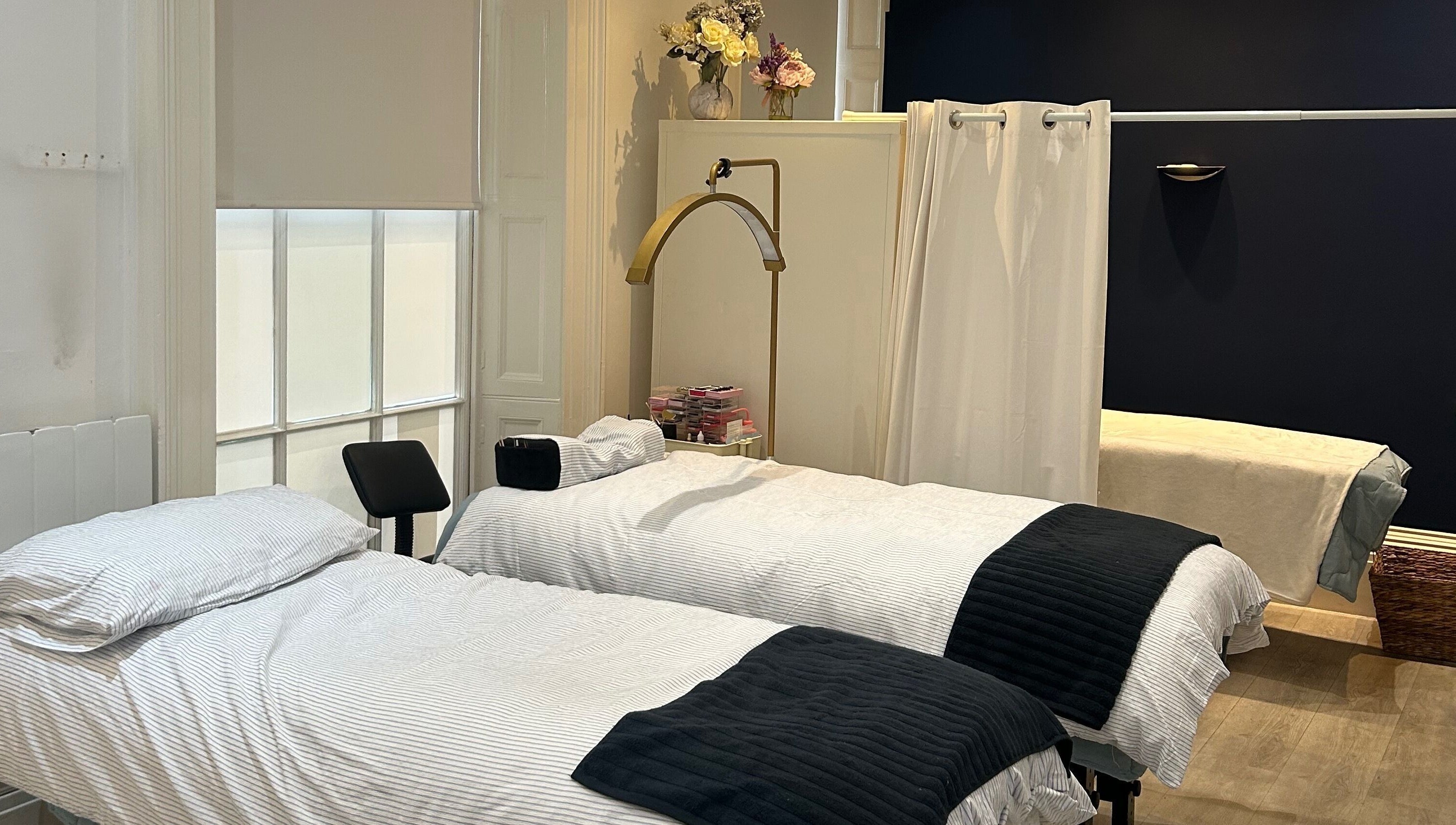Luxurious treatment beds at Hepburns on the Prom, Cheltenham, England, GB, offering serene wellness experiences.