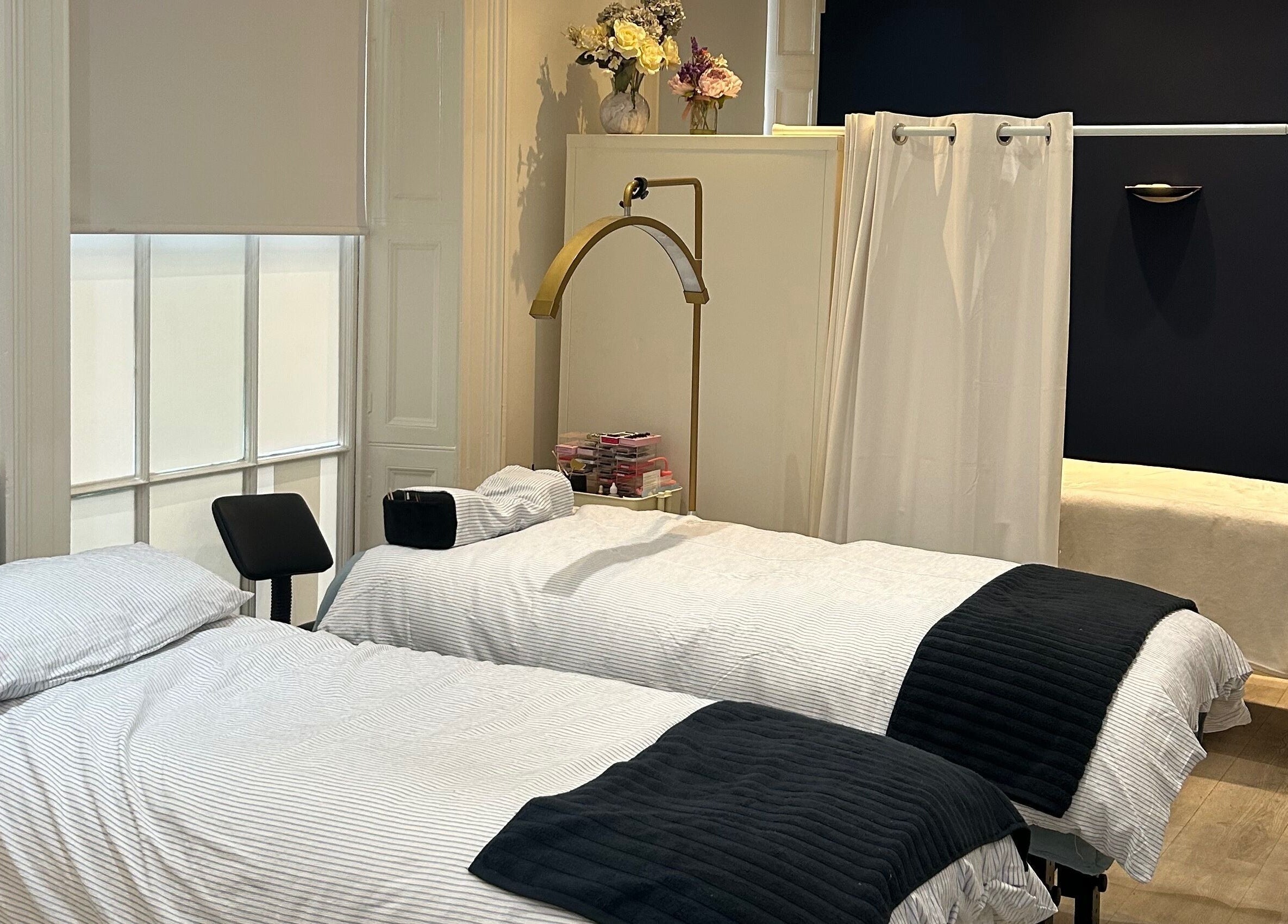 Luxurious treatment beds at Hepburns on the Prom, Cheltenham, England, GB, offering serene wellness experiences.