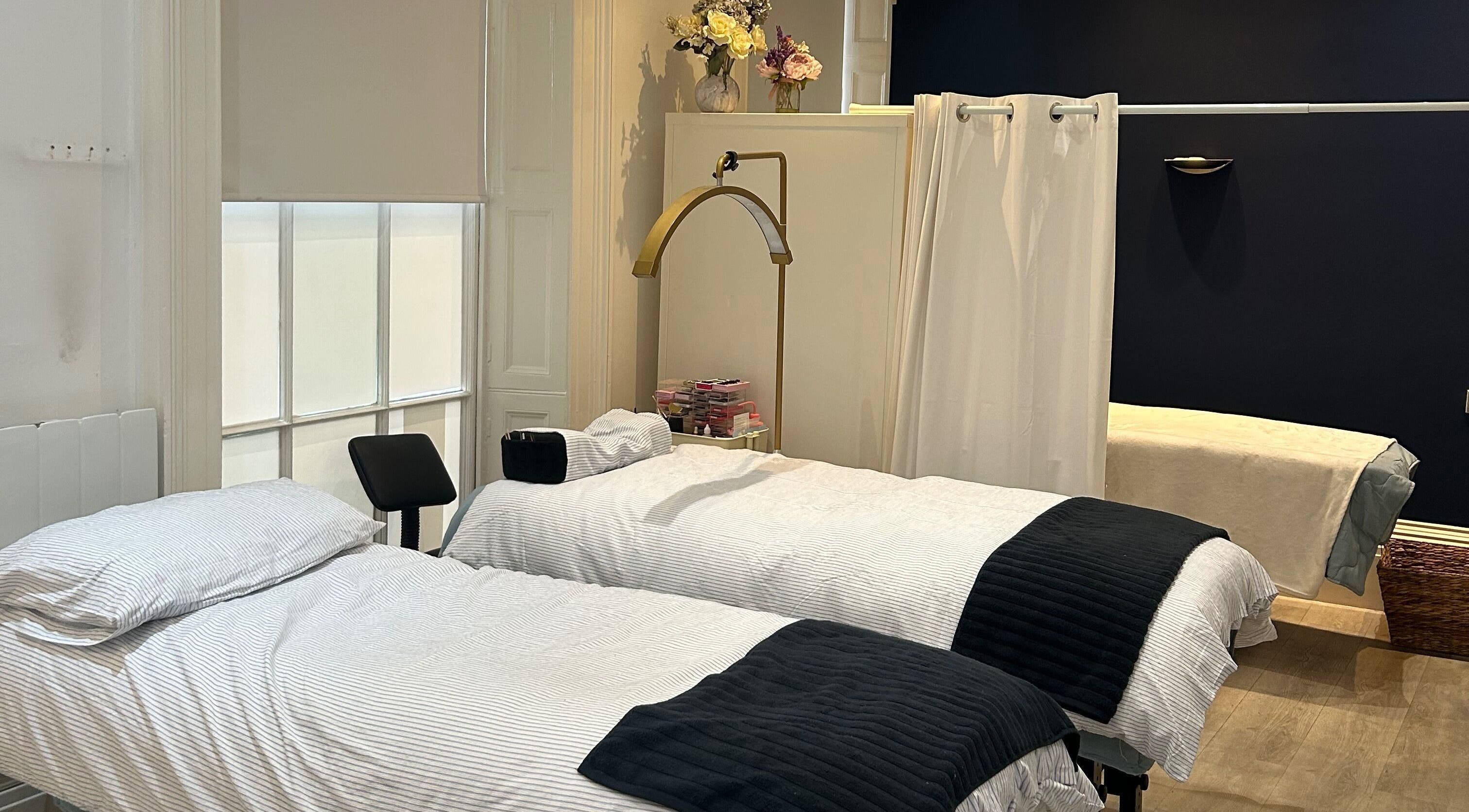 Luxurious treatment beds at Hepburns on the Prom, Cheltenham, England, GB, offering serene wellness experiences.