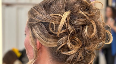 Elegant updo hairstyle at Leo & Simon Salon, Windsor, England, GB. Perfect for special occasions.