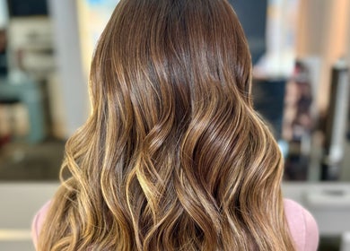 Elegant wavy hairstyle at Leo & Simon Salon in Windsor, England, GB, showcasing rich brown tones.