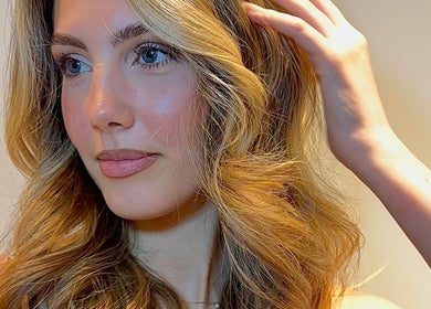A woman with styled blonde hair at Leo & Simon Salon in Windsor, England, GB.